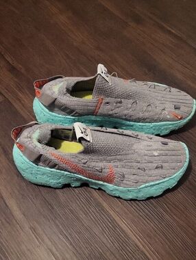 Nike Kids Gray Slip-On Sneakers with Mint Blue Soles and Orange Swoosh